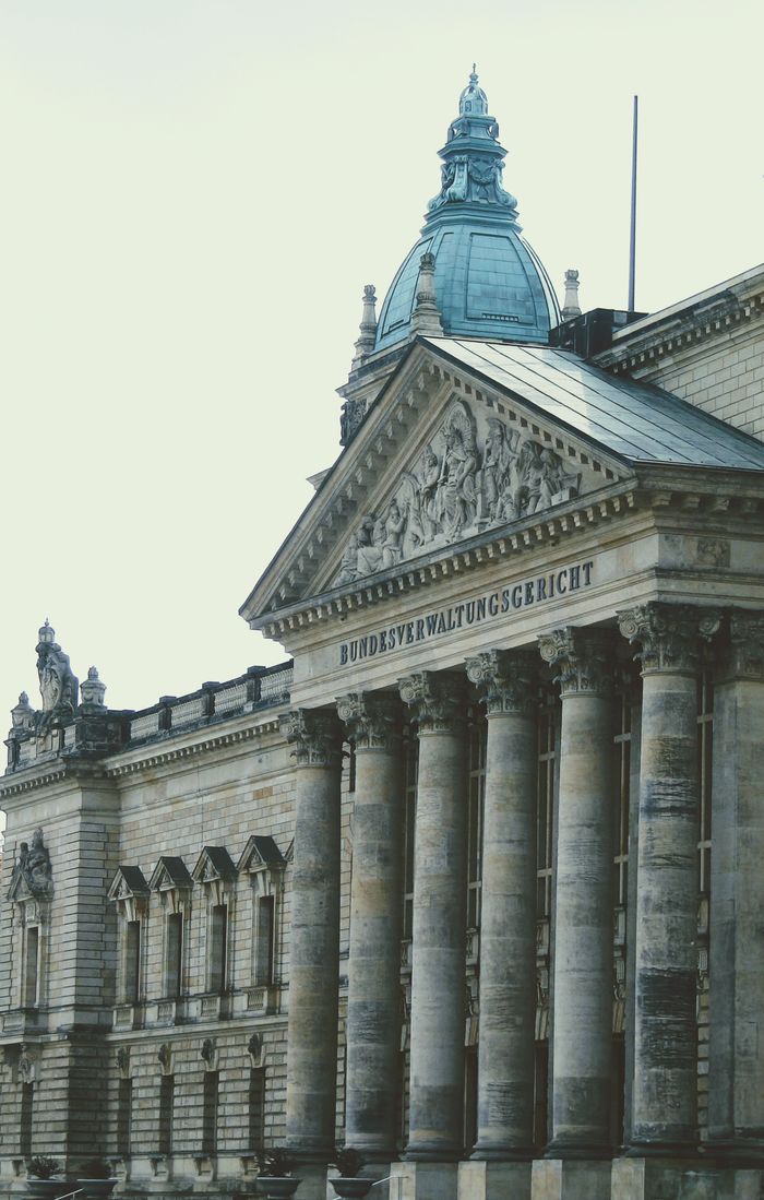 services-02 Exterior of a historic German courthouse showcasing classical architecture with ornate columns.
